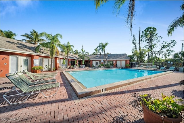 view of swimming pool with a patio