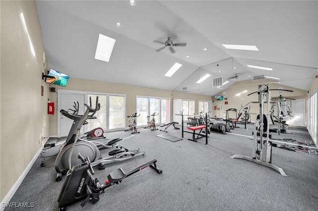 exercise room with ceiling fan and vaulted ceiling