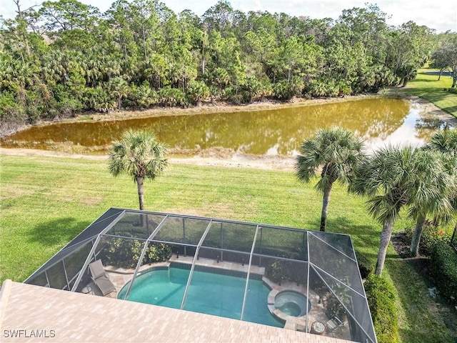 view of swimming pool featuring an in ground hot tub, a water view, and a lawn