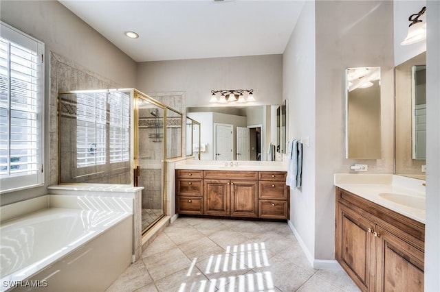 bathroom featuring vanity, tile patterned floors, and independent shower and bath