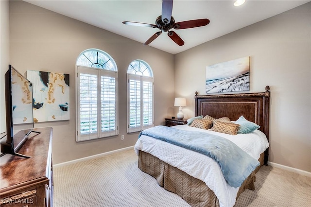 bedroom featuring light carpet and ceiling fan