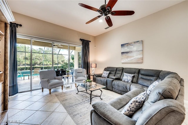 tiled living room with ceiling fan