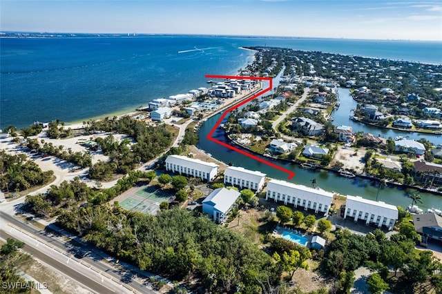 birds eye view of property with a water view