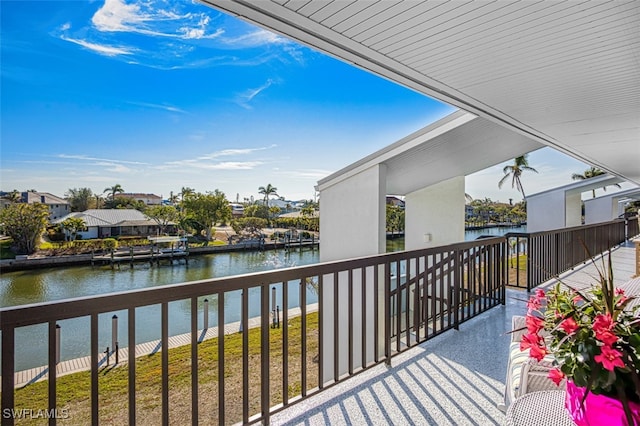 balcony featuring a water view and a residential view