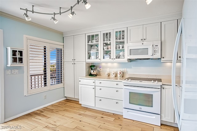 kitchen with ornamental molding, white appliances, light wood-style flooring, and white cabinets