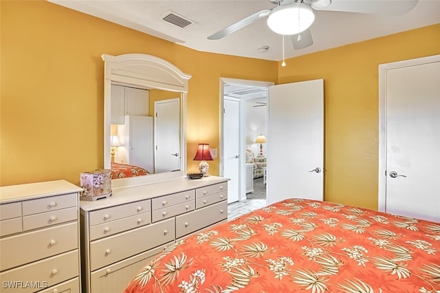 bedroom with a ceiling fan and visible vents