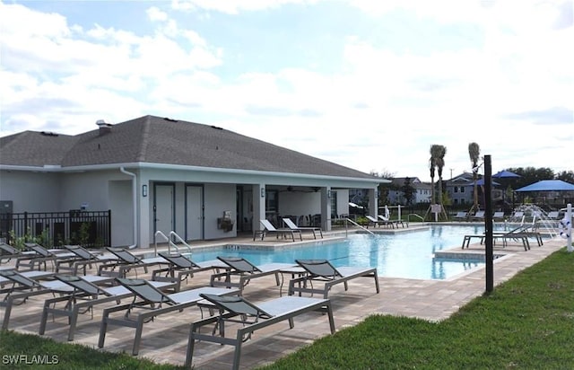 view of swimming pool with a patio area