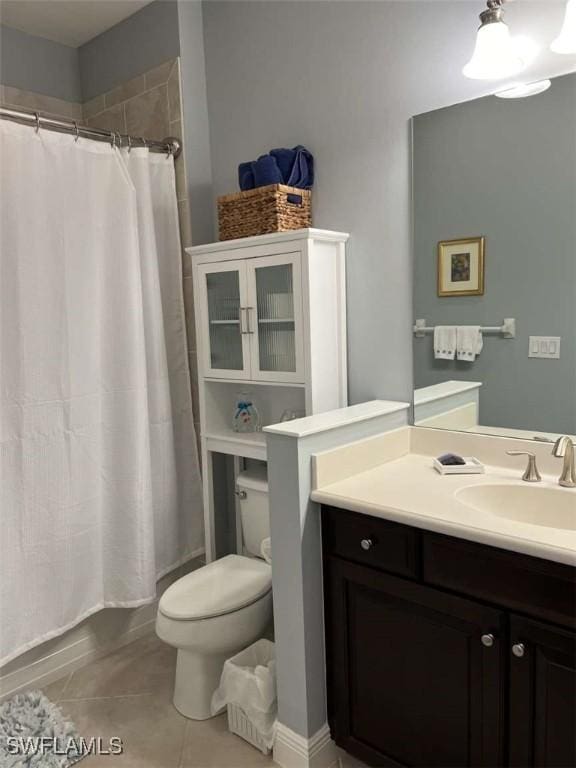 bathroom with tile patterned floors, toilet, and vanity