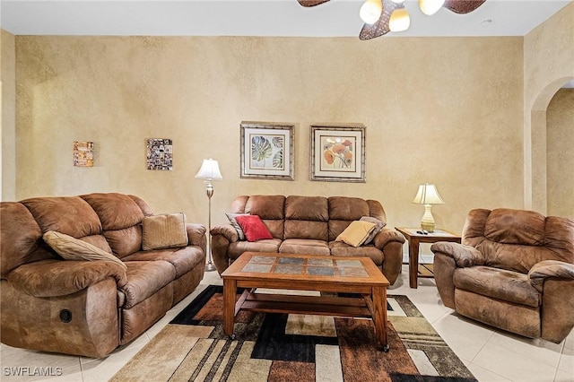 living room with light tile patterned floors and ceiling fan