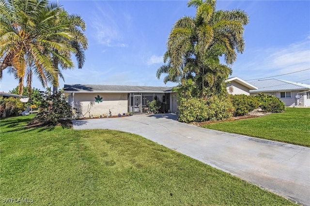 ranch-style house with a front lawn