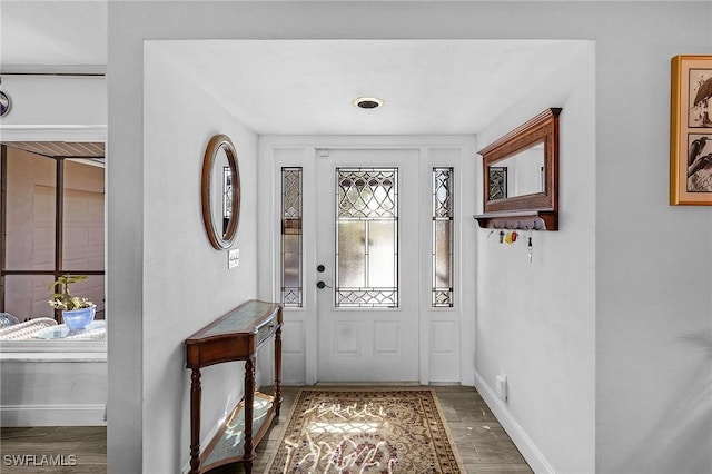 foyer entrance with hardwood / wood-style flooring