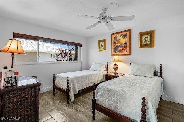 bedroom with wood-type flooring and ceiling fan