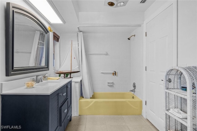 bathroom with shower / bathtub combination with curtain, vanity, and tile patterned floors