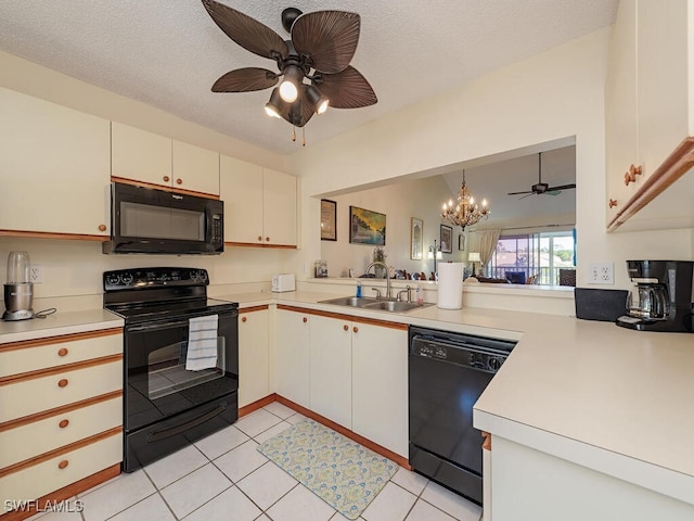 kitchen featuring white cabinetry, sink, kitchen peninsula, and black appliances