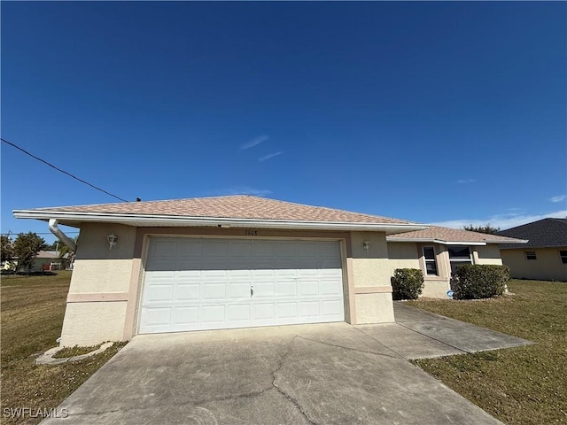 view of front of house featuring a garage and a front yard