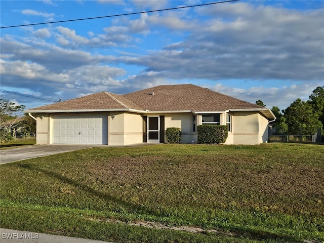 single story home featuring a garage and a front lawn