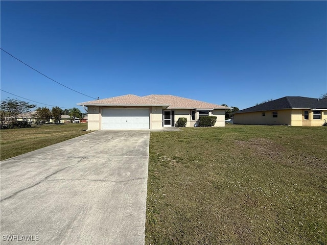 view of front of home featuring a garage and a front lawn