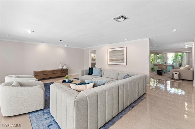 living room featuring light tile patterned floors and crown molding