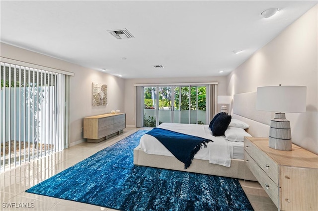 bedroom with access to exterior and light tile patterned floors