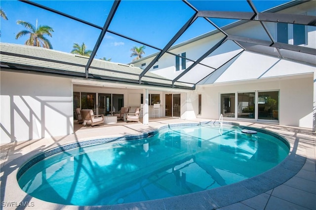 view of swimming pool featuring an outdoor hangout area, a patio, and glass enclosure