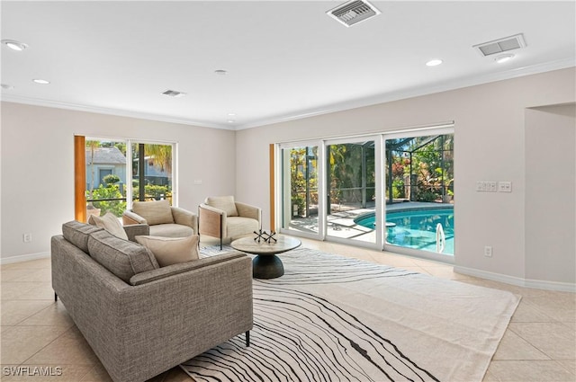 tiled living room with crown molding and a healthy amount of sunlight