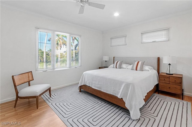 bedroom featuring crown molding and light wood-type flooring