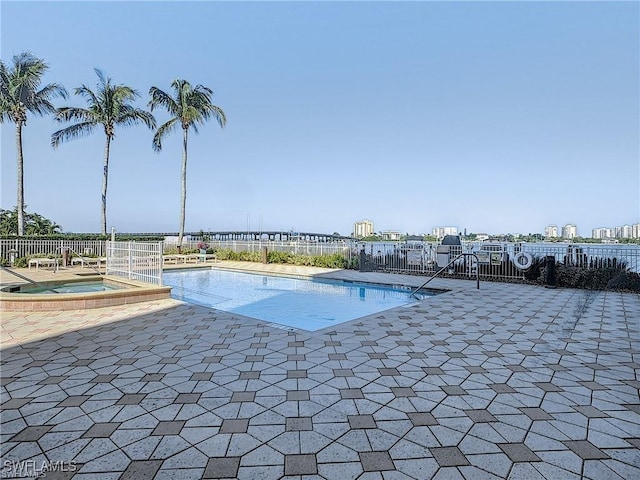 view of swimming pool with a community hot tub