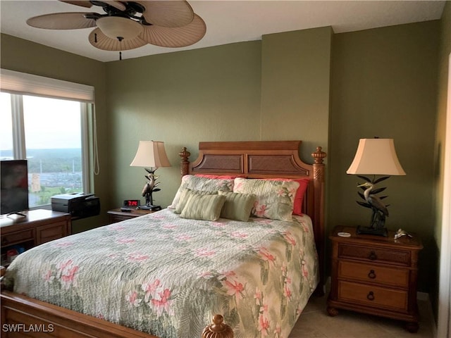 tiled bedroom with ceiling fan