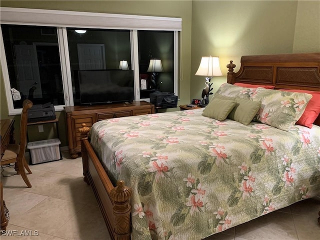 bedroom with light tile patterned flooring