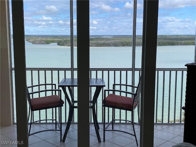 balcony featuring a water view