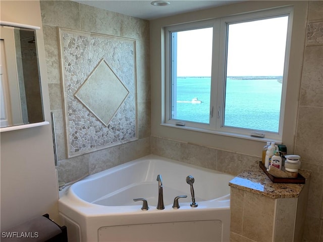 bathroom featuring a garden tub