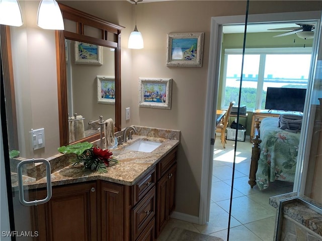 bathroom featuring ceiling fan, vanity, and tile patterned floors