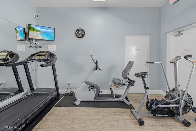 exercise area with wood-type flooring