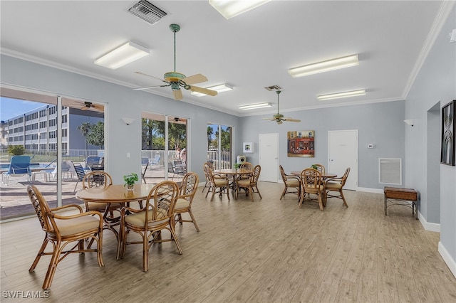 dining space featuring ceiling fan, ornamental molding, light hardwood / wood-style floors, and a healthy amount of sunlight