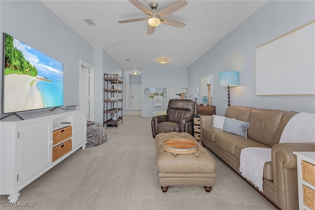 carpeted living room with ceiling fan