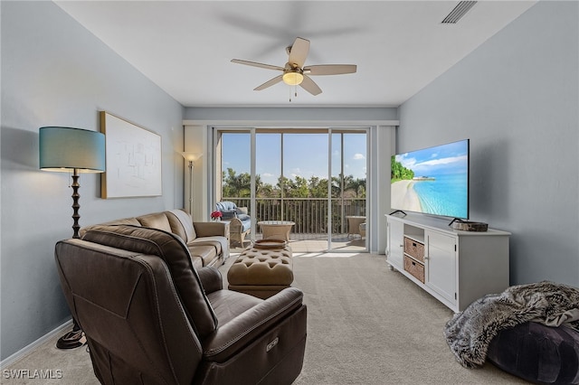 living room featuring light carpet and ceiling fan