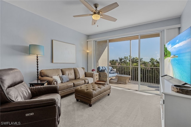 living room with ceiling fan and light colored carpet