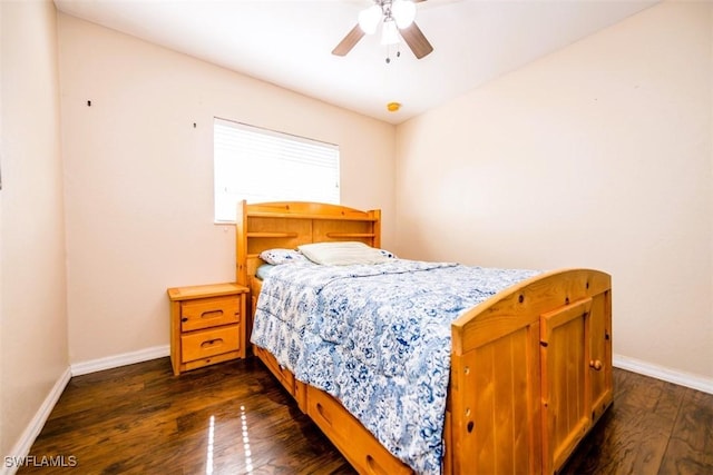 bedroom with dark wood-type flooring and ceiling fan