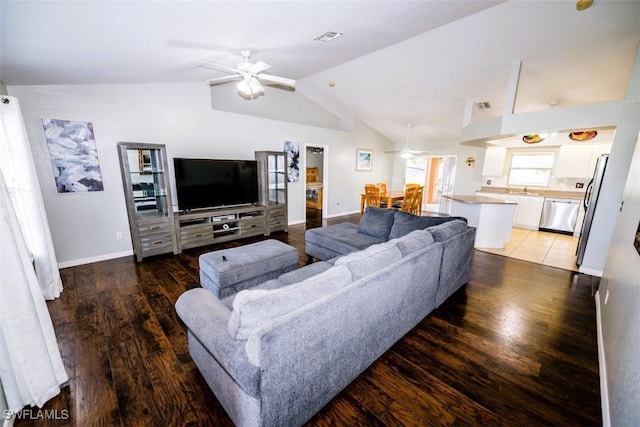 501 NE 24th Ter, Cape Coral, FL 33909 - living room featuring vaulted ceiling, dark wood-type flooring, and ceiling fan