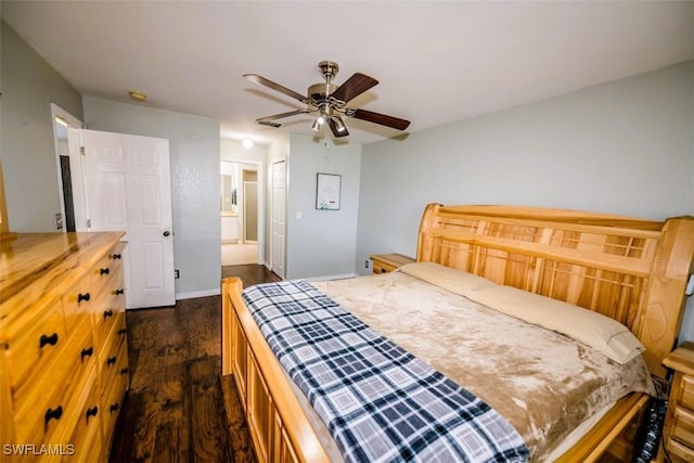 501 NE 24th Ter, Cape Coral, FL 33909 - bedroom featuring ensuite bathroom, ceiling fan, dark hardwood / wood-style flooring, and a closet
