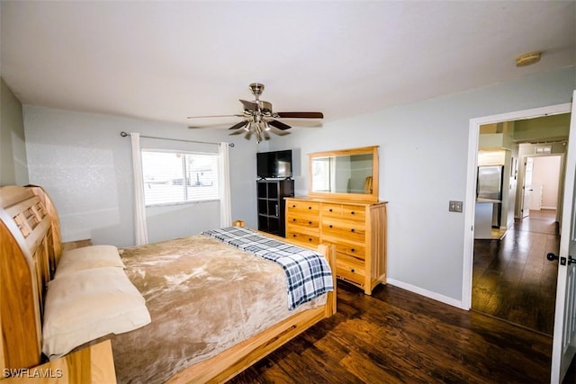 bedroom with dark wood-type flooring and ceiling fan