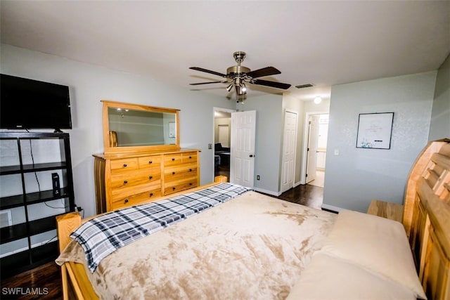 bedroom with dark wood-type flooring and ceiling fan