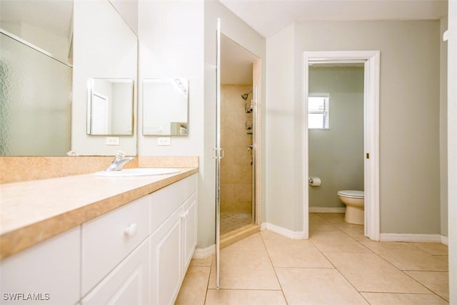 501 NE 24th Ter, Cape Coral, FL 33909 - bathroom with vanity, toilet, a shower with shower door, and tile patterned flooring