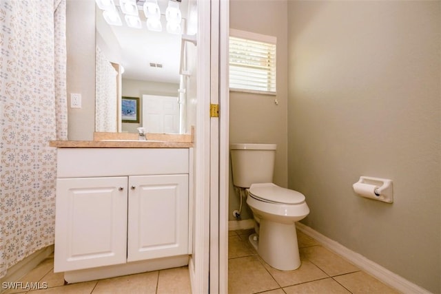 501 NE 24th Ter, Cape Coral, FL 33909 - bathroom with vanity, tile patterned flooring, and toilet