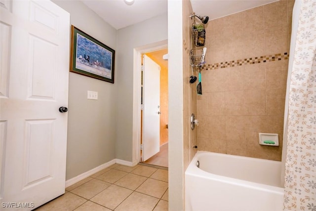 501 NE 24th Ter, Cape Coral, FL 33909 - bathroom featuring shower / tub combo and tile patterned flooring