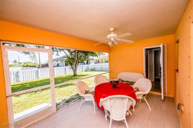 sunroom / solarium with ceiling fan