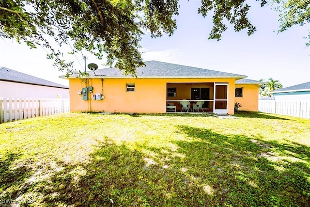 501 NE 24th Ter, Cape Coral, FL 33909 - rear view of house with a yard and a sunroom