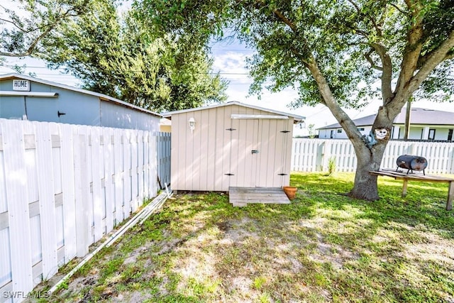 501 NE 24th Ter, Cape Coral, FL 33909 - view of outbuilding with a lawn