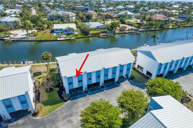 birds eye view of property featuring a water view