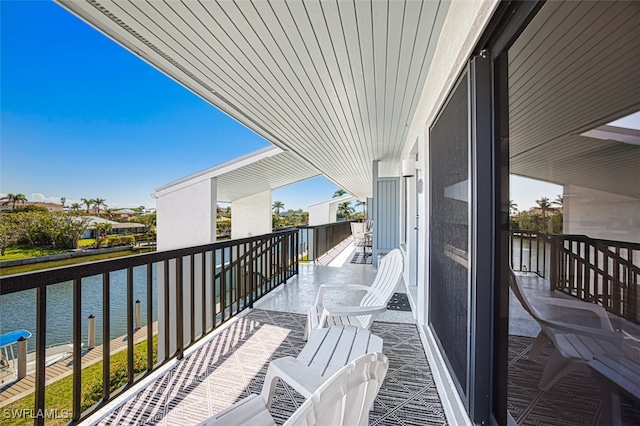 balcony featuring a water view